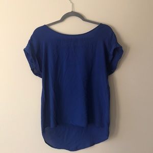 Blue shirt by pink rose